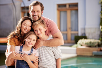 Happy family, relax outside house and portrait with children, mom and dad smile with love by pool together. Outdoor of mother, father and young kids hug together outside a modern home summer bonding
