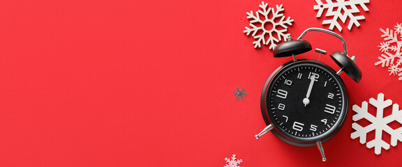 Stylish alarm clock and snowflakes on red background with space for text - obrazy, fototapety, plakaty