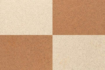 Fototapeta premium Texture of craft beige and brown paper background with cells pattern. Vintage kraft sand cardboard.