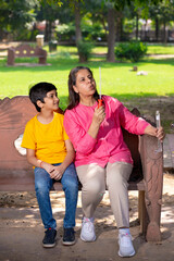 Happy grandmother with grandson together at garden