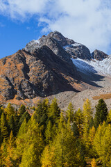 The mountains of the Val di Camp, a small valley near the village of Poschiavo, during an autumn day, Canton of Grisons, Switzerland - October 2022.