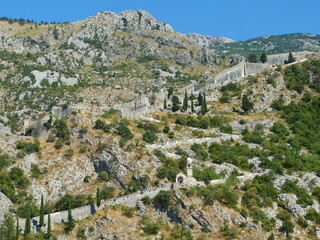 Fototapeta na wymiar Montenegro Kotor old town ancient fortress wall in mountains.