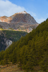 The mountains of the Val di Camp, a small valley near the village of Poschiavo, during an autumn day, Canton of Grisons, Switzerland - October 2022.