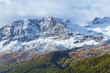Fototapeta premium The mountains of the Val di Camp, a small valley near the village of Poschiavo, during an autumn day, Canton of Grisons, Switzerland - October 2022.