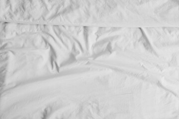 Closeup view of white crumpled bedding