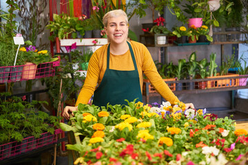 Florist with assortment of colorful flowers and plants