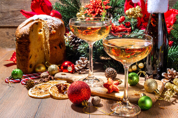 Merry Christmas and New Year holiday celebration with champagne. on wooden table with Christmas tree and decoration 