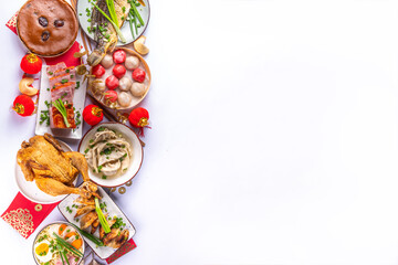 Traditional Chinese lunar New Year dinner table, party invitation, menu background with pork, fried fish, chicken, rice balls, dumplings, fortune cookie, nian gao cake, noodles, chinese decorations