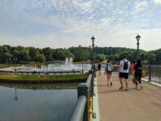 Moscow, Russia - August 30, 2022: Tsaritsyno Museum-Reserve. People walk along the bridge to the fountain