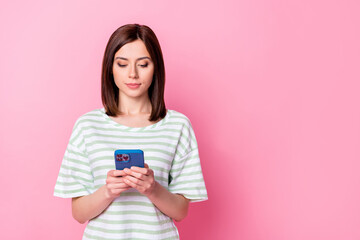 Photo of pretty lady write instagram telegram facebook post share news comment repost empty space isolated on pink color background