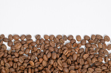 Texture of roasted coffee beans, place for inscription and advertisement.