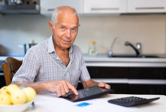 Grandfather Man Doing Online Payment From Digital Tablet. Elderly Senior Caucasian Grandpa Paying Bills Online