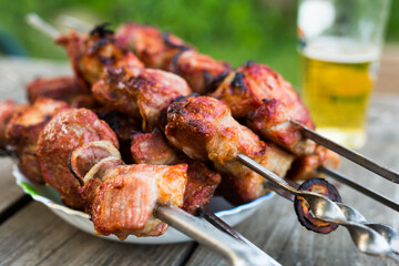 Top view of tasty shish kebab from pork on plate