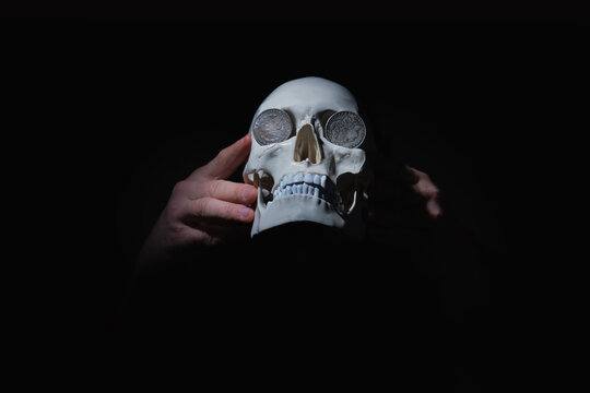 Symbol image of Charon's obol: myth about coins on the eyes of the dead. Coins were a bribe or payment used to ferry the dead across the river Styx into the Underworld kingdom of Hades