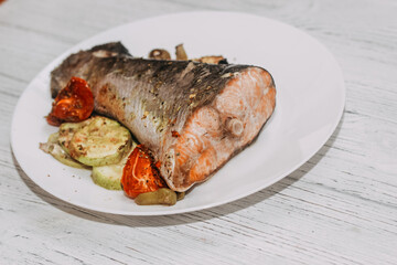 Red fish trout salmon baked in the oven with vegetables.