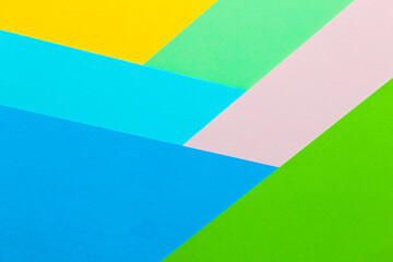 Multicolored geometric background from paper cardboard abstraction.