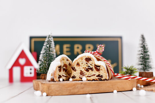 Cut open German Stollen cake, a fruit bread with nuts, spices, and dried fruits with powdered sugar traditionally served during Christmas time