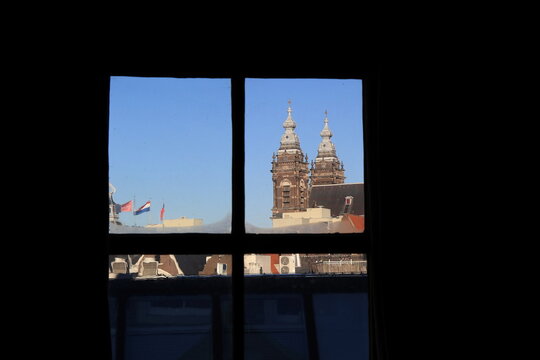 View from the Ons' Lieve Heer op Solder Church with Sint-Nicolaas Kerk Church Towers in Amsterdam, Netherlands