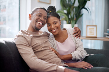 Black couple, hug and portrait smile on sofa in relax for relationship bonding together at home....