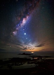 Fototapeta na wymiar Milky way over the coast as dawn approaches