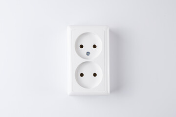 White double socket isolated on white background. Electric lighting concept