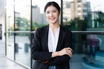 Portrait of a beautiful young Asian businesswoman at the company