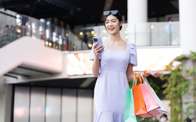 happy Asian woman shopping at mall