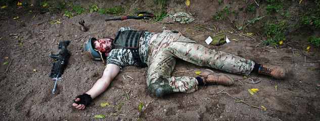 Wounded soldier lie on the battlefield