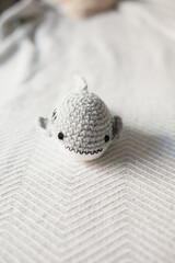 Crocheted shark toy for kid. Cozy holiday season. Hobby making amigurumi crochet toys as DIY gifts for kids. Winter hobby. Crochet patterns leisure and small business.