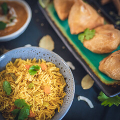 fried rice, samosa , salad, roti, with tea