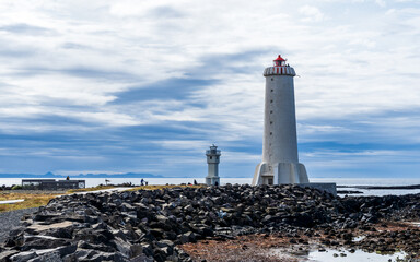 Fototapeta na wymiar lighthouse on the shore of the sea