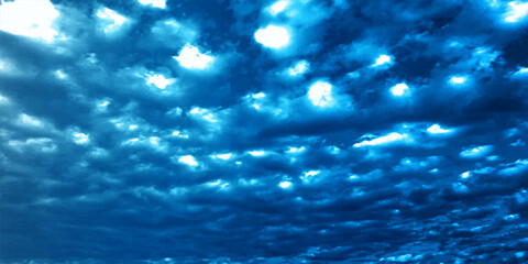 blue sky background with white clouds texture, abstract deep blue in the surface sky, sunlight reflection on the clouds wallpaper, Natural abstract clouds blue sky evening view.