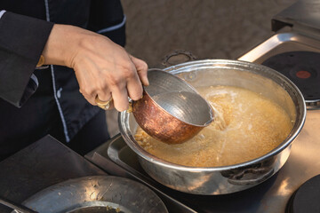 Pouring water to cook bulgur