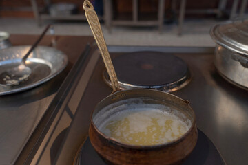 Frying butter in copper pan