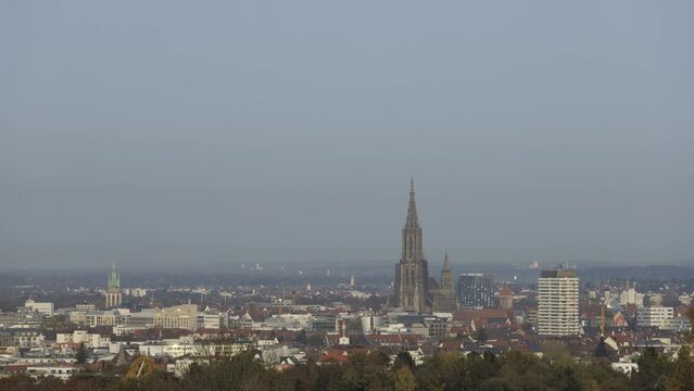 Ulm city center and Ulm minster from day to night on a foggy evening time lapse