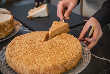 Serving homemade honey cake in a cafe