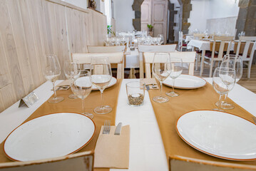 Fototapeta na wymiar Served tables in an empty restaurant