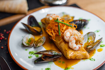 Stuffed pancake with shrimps and mussels