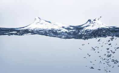 Water splash Aqua flowing in waves and creating bubbles Drops on the water surface feel fresh and clean isolated on white background.