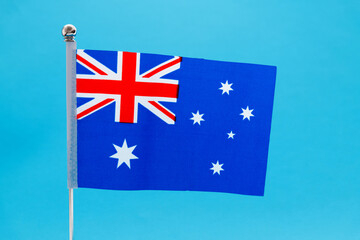 Fototapeta premium Australian national flag waving on blue background