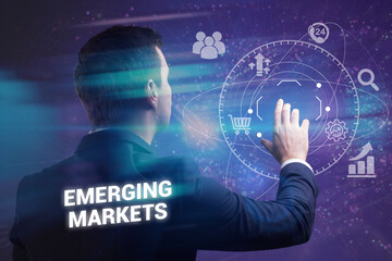 Business, technology, internet and network concept. Young businessman thinks over the steps for successful growth: Emerging markets