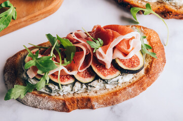 Open Sandwich with Blue Cheese, Figs, Rocket salad leaves and Prosciutto