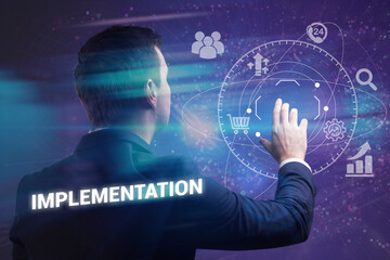 Business, technology, internet and network concept. Young businessman thinks over the steps for successful growth: Implementation