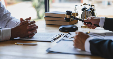 The business lawyer working about legal legislation in courtroom to help their customer, the Lawyer...