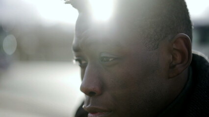 Worried African man suffering from emotional pain. Black person feeling preoccupied emotion