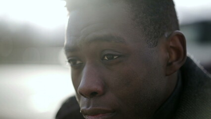 Worried African man suffering from emotional pain. Black person feeling preoccupied emotion