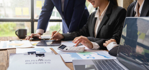 team of financiers are analyzing the company's earnings at meetings, intercompany business meetings.