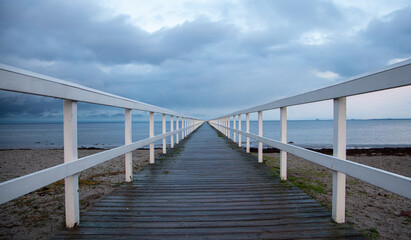 Naklejka premium wooden pier on the sea 