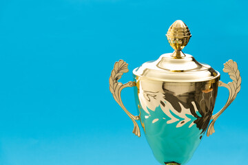 Golden trophy cup with a lid