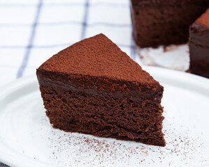 A slice of classic soft and rich chocolate cake
